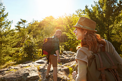 Buy stock photo Nature, hiking and couple with sunshine, climbing and adventure holiday in mountain from back. Trekking, man and woman on travel vacation together in park with trees, bush and outdoor walking date 