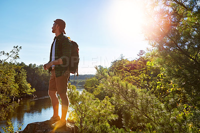 Buy stock photo Hiking, thinking and man on mountain with lake for adventure, trekking and freedom. Travel, nature and happy person outdoors for wellness, walking and exercise on holiday, journey and vacation