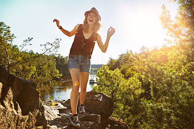 Buy stock photo Hiking, laughing and woman in nature with lake for adventure, trekking and freedom outdoors. Morning, mountain and happy person for travel, walking and exercise on holiday, journey and vacation