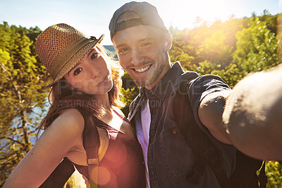 Buy stock photo Shot of a young couple taking a selfie while out on an adventurous date