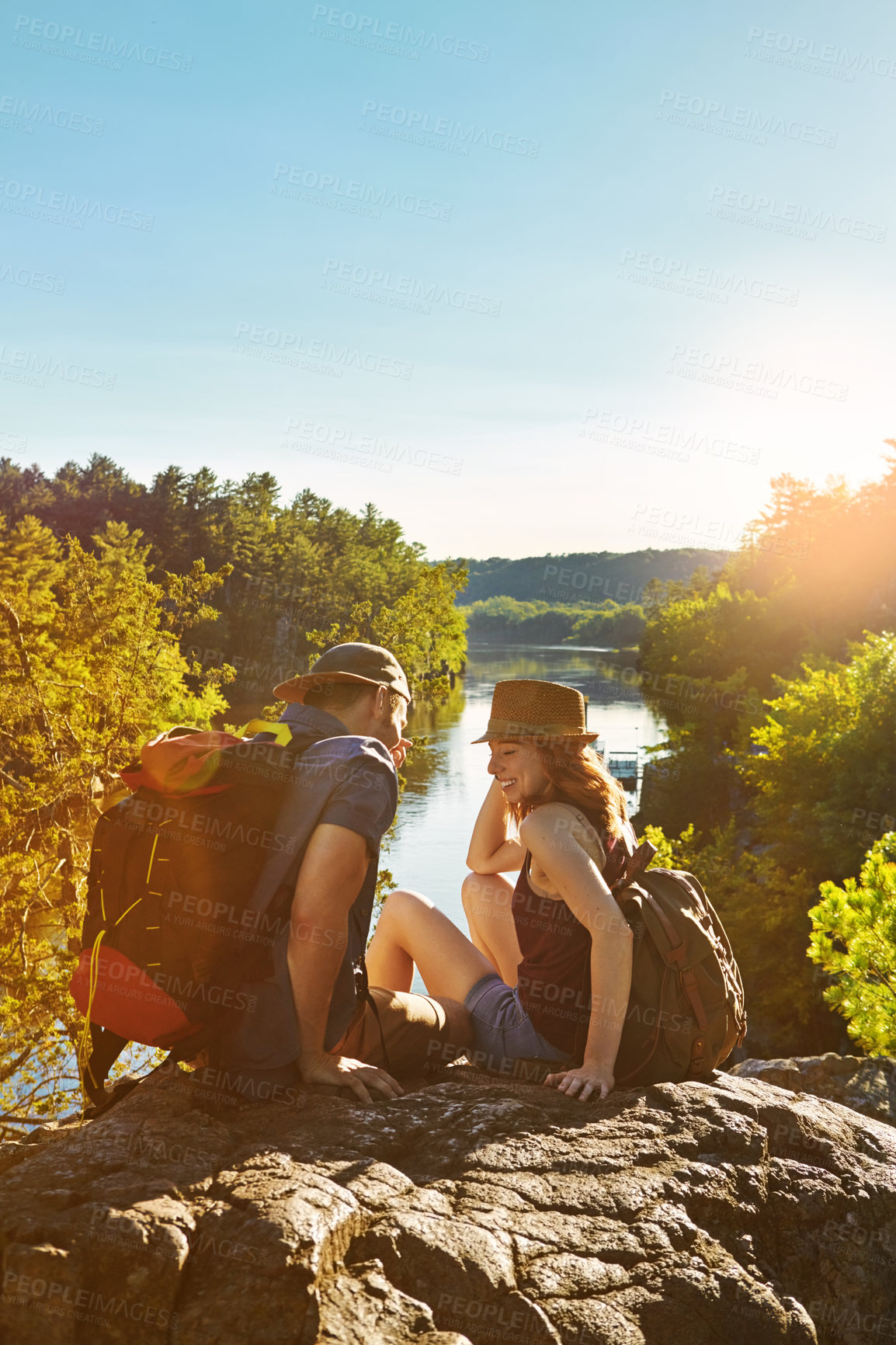 Buy stock photo Shot of two young people hiking while on an overseas trip