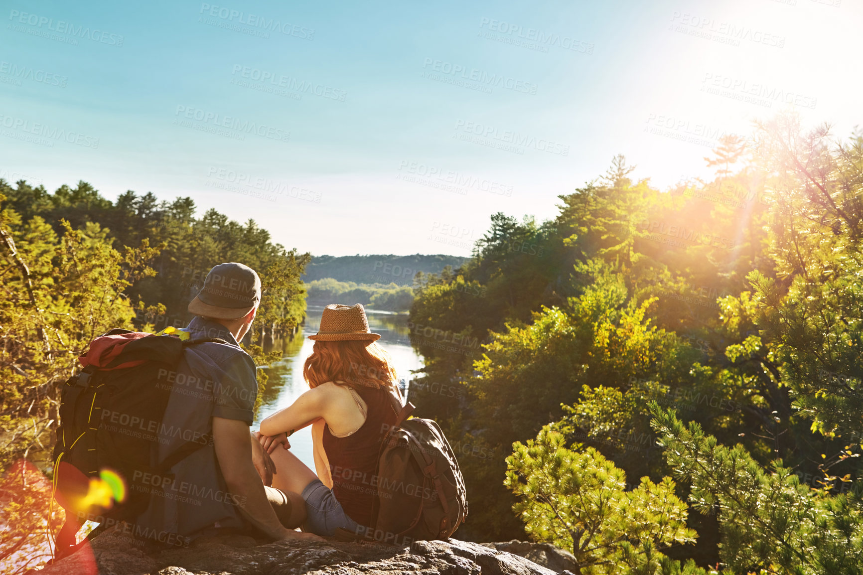 Buy stock photo Shot of two young people hiking while on an overseas trip