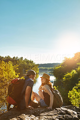 Buy stock photo Shot of two young people hiking while on an overseas trip