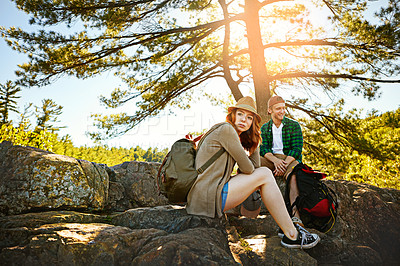 Buy stock photo Shot of two young people hiking while on an overseas trip