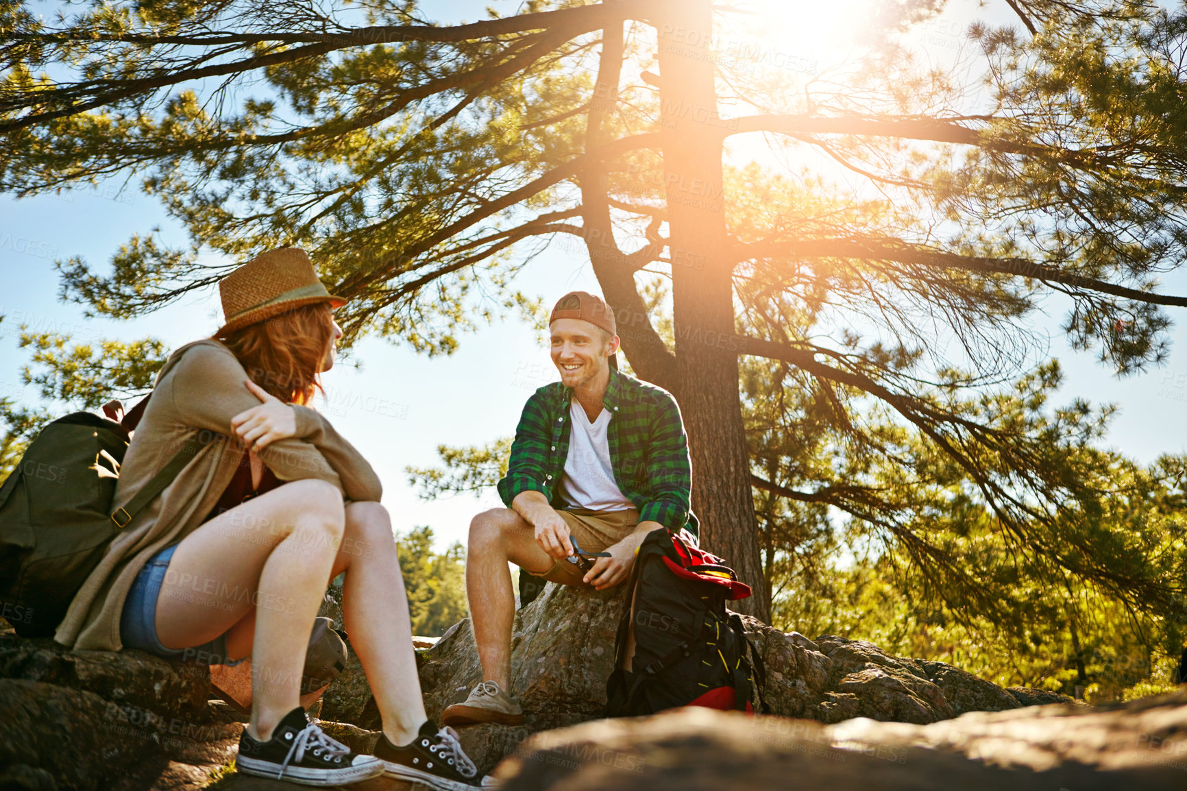 Buy stock photo Shot of two young people hiking while on an overseas trip