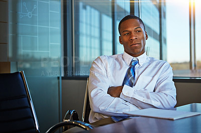 Buy stock photo Cropped shot of a businessman sitting thoughtfully in his office