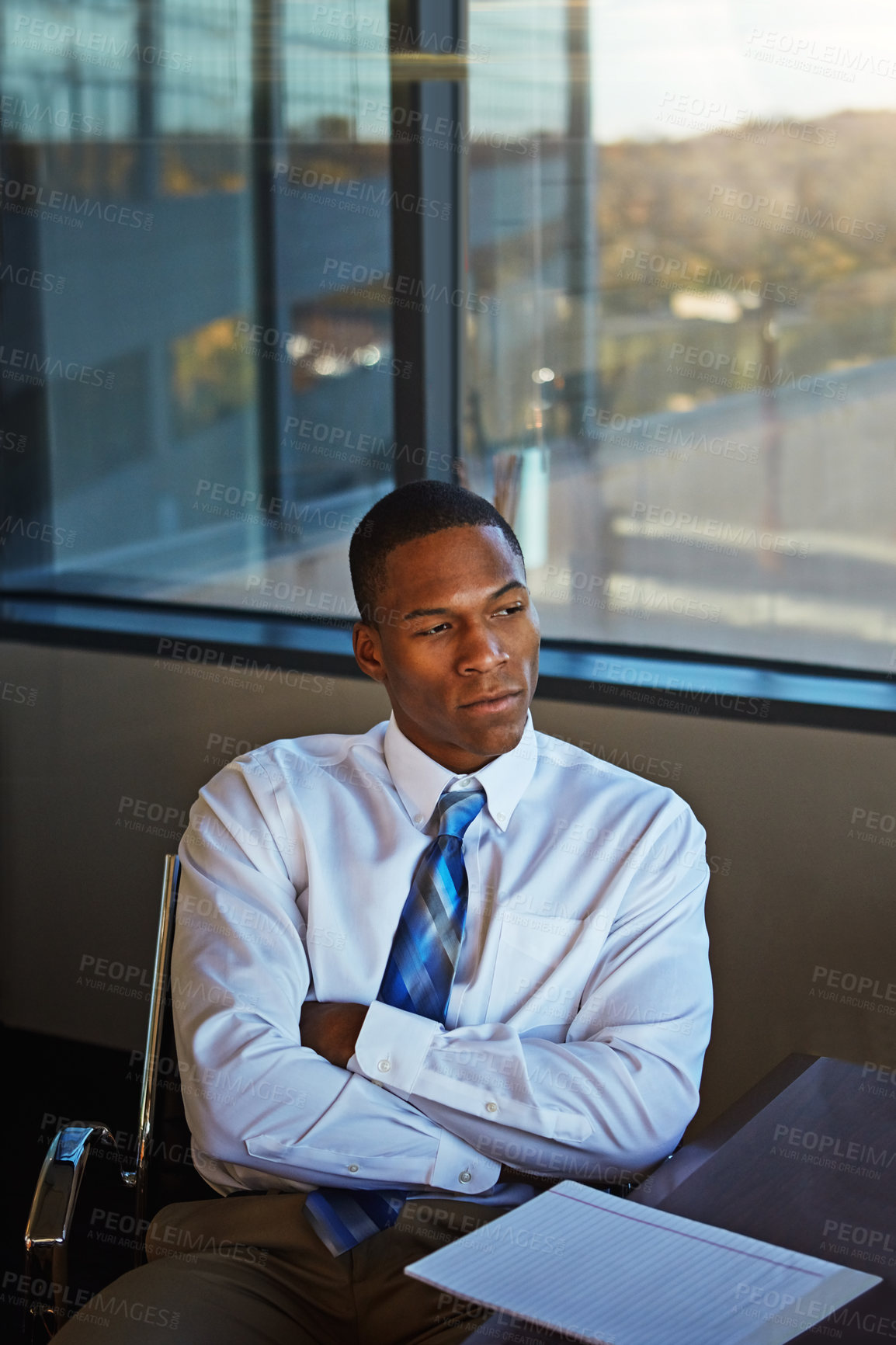 Buy stock photo Cropped shot of a businessman sitting thoughtfully in his office