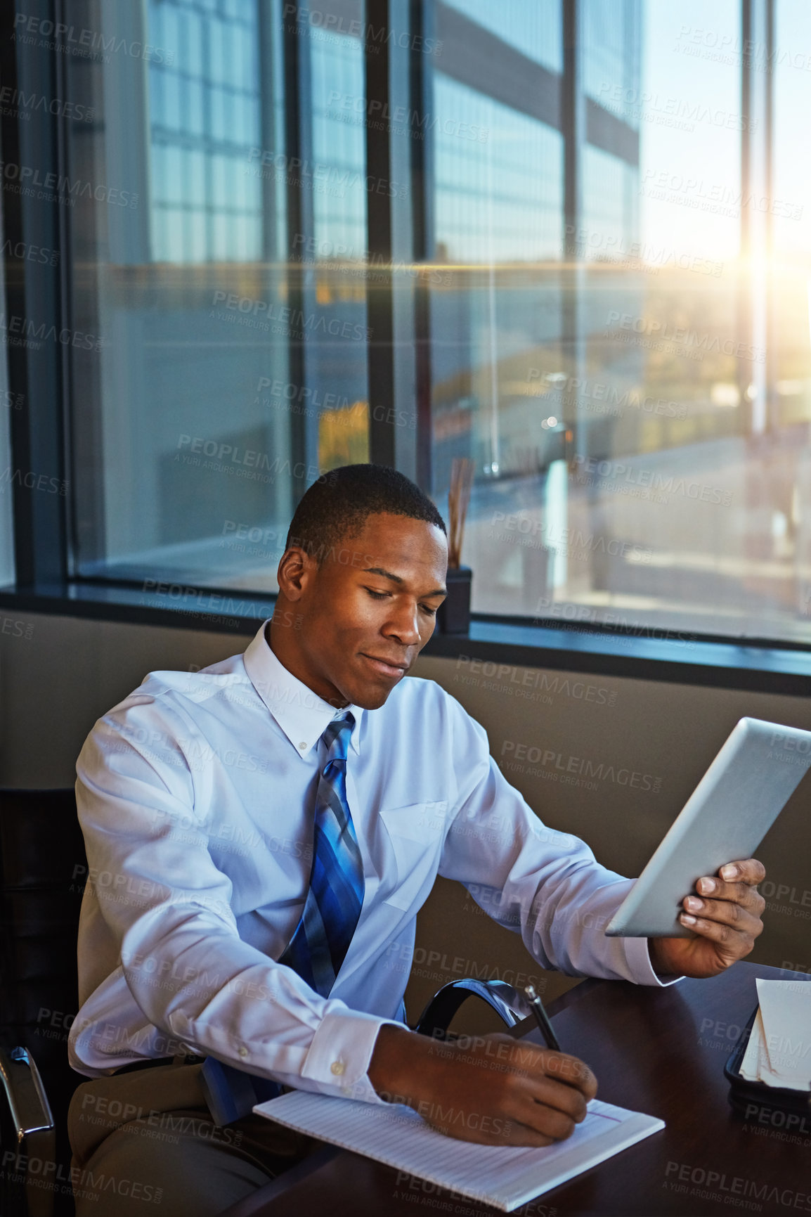 Buy stock photo Businessman, accounting and writing with tablet for finance, legal paperwork or budget planning at office. Black man, financial advisor or accountant taking notes with technology for report or audit