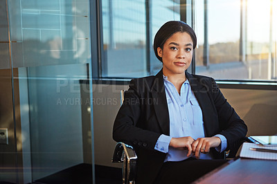 Buy stock photo Shot of a businesswoman sitting at her desk