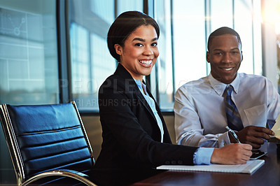 Buy stock photo Cropped portrait of two young businesspeople meeting in the boardroom