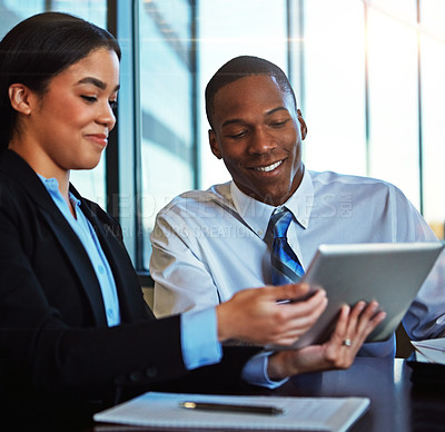 Buy stock photo Cropped shot of two young businesspeople meeting in the boardroom