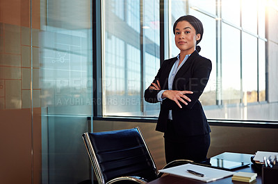 Buy stock photo Portrait of a young female lawyer standing by her desk in the office