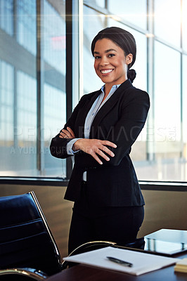 Buy stock photo Portrait of a young female lawyer standing by her desk in the office