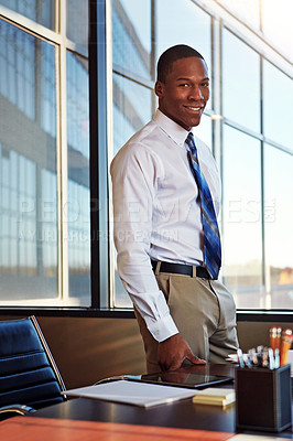 Buy stock photo Portrait of a young male lawyer standing by his desk in the office