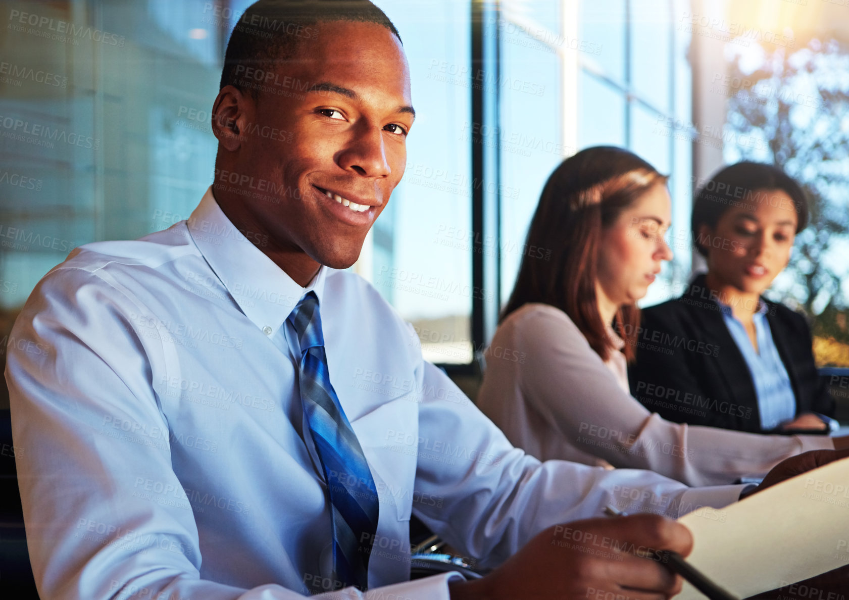 Buy stock photo Meeting, portrait and man in office with file, job goals and pride in project management. Happy, team or operations lead in workplace with folder, confidence or career growth in task coordination.