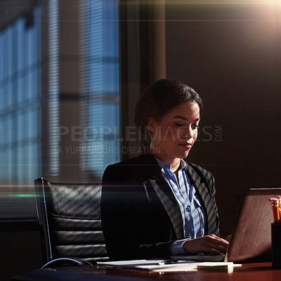 Buy stock photo Shot of a businesswoman using her laptop at her desk