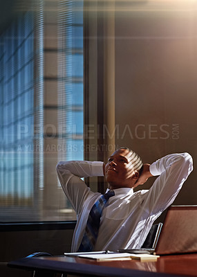 Buy stock photo Cropped shot of a businessman sitting thoughtfully in his office