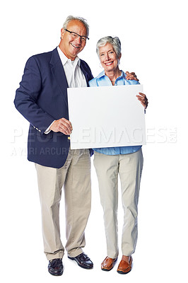 Buy stock photo Senior, happy and blank sign couple portrait of elderly people holding a billboard poster. White background, isolated and marriage of retirement man and woman with advertisement and marketing space