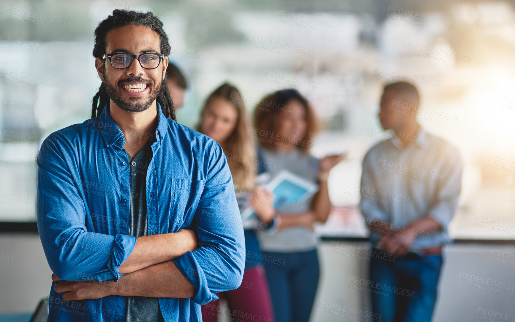 Buy stock photo Arms crossed, portrait and smile with business man in creative workplace for leadership of team. Confident, glasses and smile of employee person with braids in designer workplace for collaboration