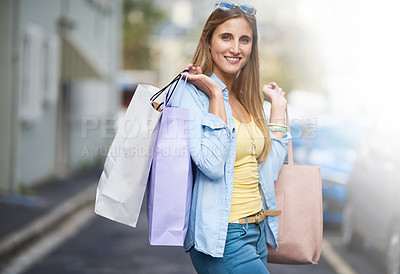 Buy stock photo Portrait of an attractive young woman out on a shopping spree in the city