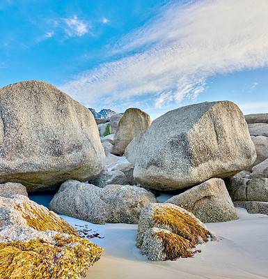 Buy stock photo Rocks, boulder and outdoor at beach, sky and clouds with environment in summer with formation by sea sand. Stone, sunshine and nature at location, erosion and landscape with paradise in Costa Rica