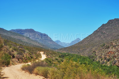 Buy stock photo Outdoor, nature and path in hill bush, holiday location and peace in sustainable landscape. Earth, meadow trail and texture to explore on vacation, remote adventure and wild environment for travel