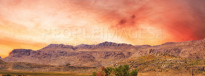 Buy stock photo Mountains, sunset and red sky with landscape, nature and banner at wilderness park, plants and location. Hill, environment and geology with clouds, sustainability and outdoor at dusk in New Zealand