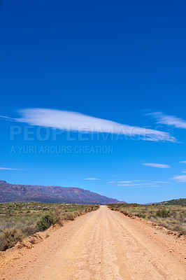 Buy stock photo Dirt road, blue sky and mountains with nature, environment and ecology with countryside. Empty, clouds and path with Australia desert, landscape and adventure with sand for earth and travel.