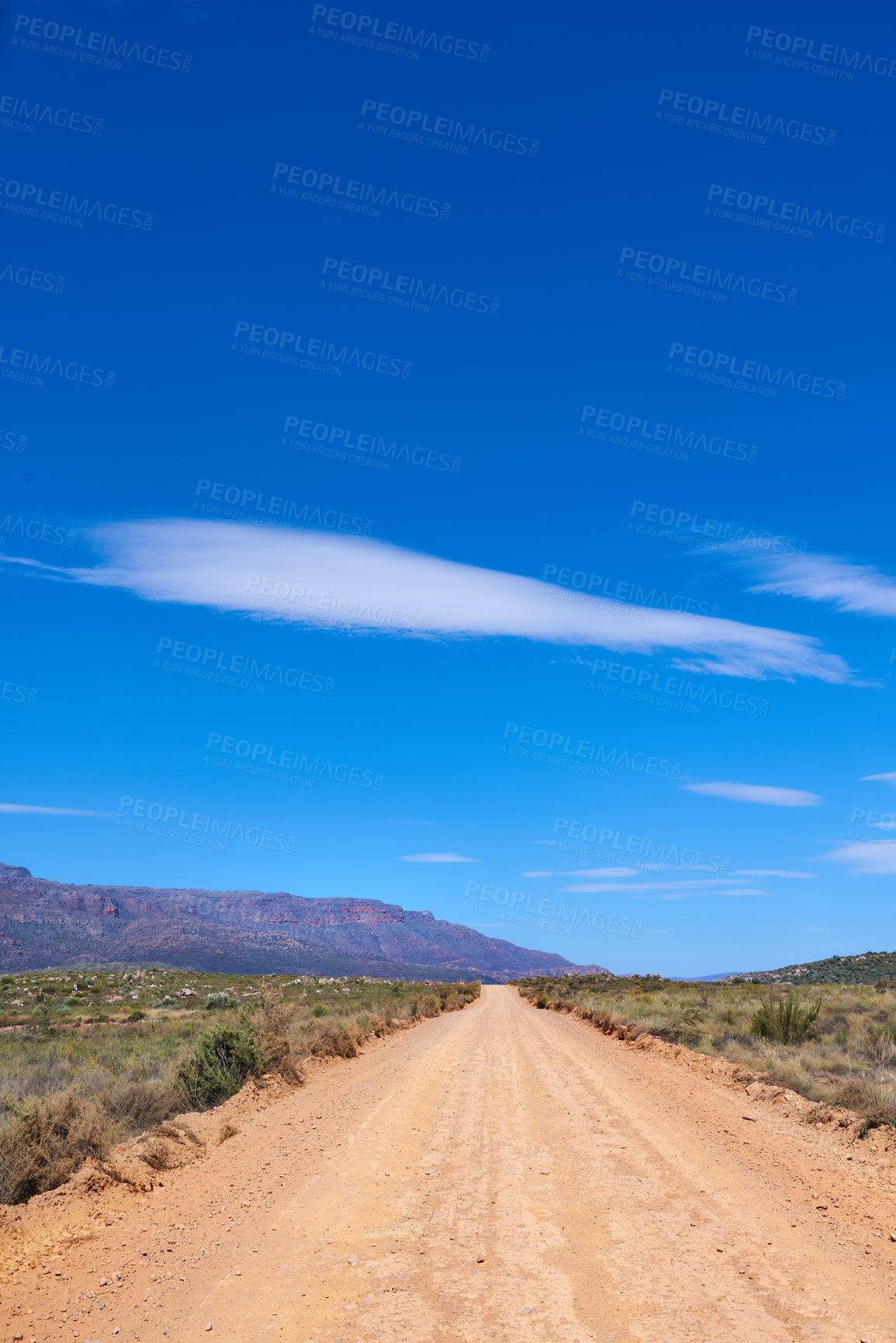 Buy stock photo Dirt road, blue sky and mountains with nature, environment and ecology with countryside. Empty, clouds and path with Australia desert, landscape and adventure with sand for earth and travel.