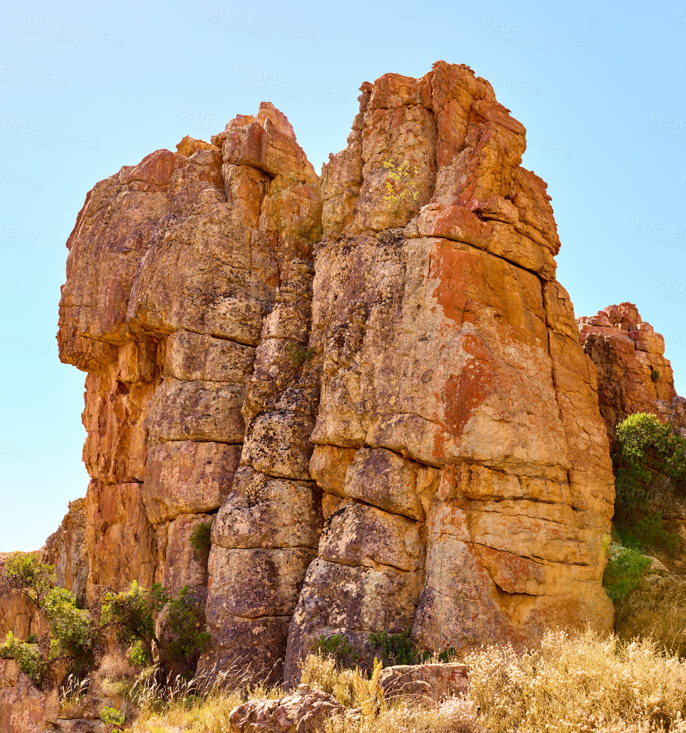 Buy stock photo Environment, erosion and outdoor with rock, formation and geology at location, bush and summer. Countryside, stone and landscape at nature park, field and outcrop with sunshine in South Africa