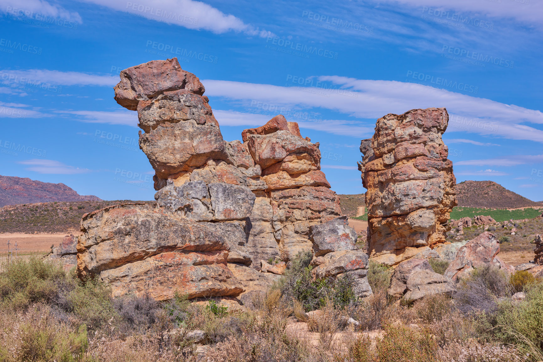 Buy stock photo Nature, erosion and outdoor with rock, formation and geology at location, environment and summer. Countryside, stone and landscape by mountains, field and outcrop with sunshine in South Africa