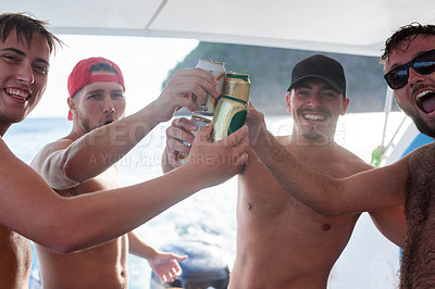 Buy stock photo Portrait of a group of guys drinking beer while on a boat at sea