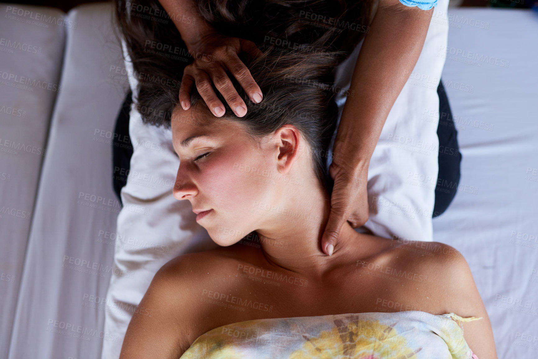 Buy stock photo High angle shot of a young woman getting a relaxing massage at the spa