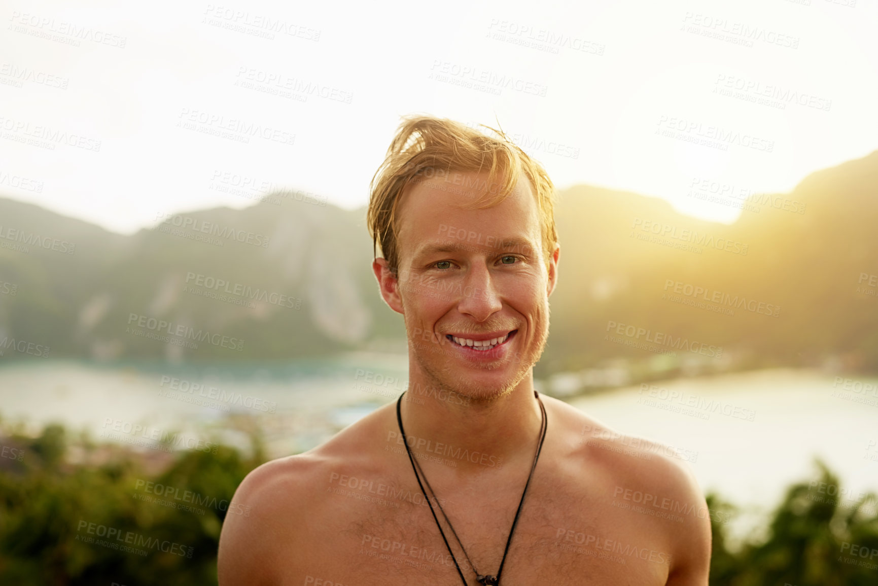 Buy stock photo Portrait of a happy young man admiring a tropical view while on holiday