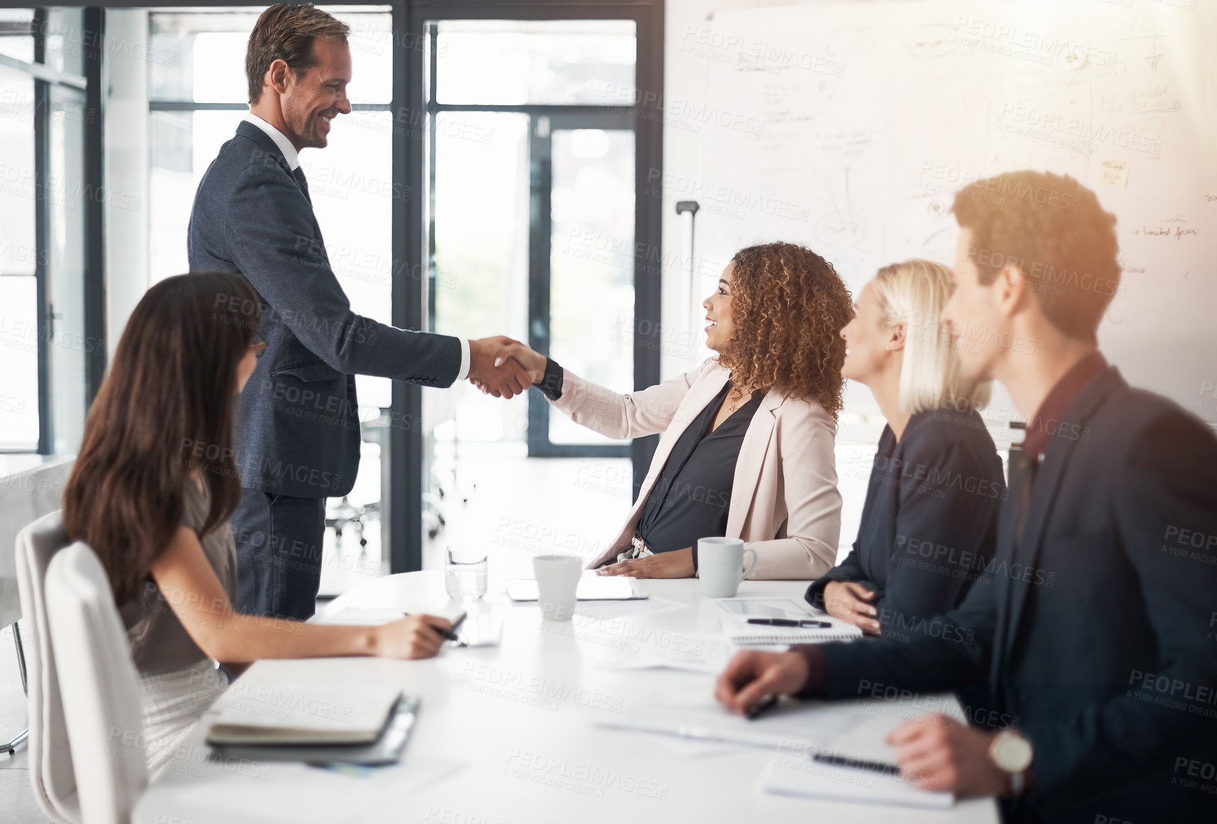Buy stock photo Business people, handshake and meeting for teamwork, agreement or partnership in conference at the office. Businessman shaking hands with woman for b2b, corporate growth or hiring at the workplace