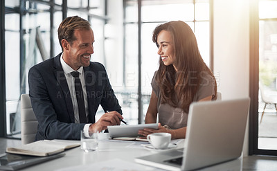 Buy stock photo Business people, tablet and meeting in collaboration for project, teamwork or partnership at the office. Happy businessman and woman in team discussion on technology, corporate strategy or planning