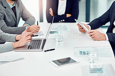 Buy stock photo Shot of a group of unrecognizable businesspeople meeting in the boardroom