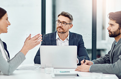 Buy stock photo Cropped shot of a group of businesspeople meeting in their office