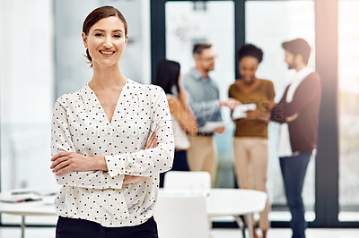 Buy stock photo Portrait of a businesswoman in the office with her colleagues in the background