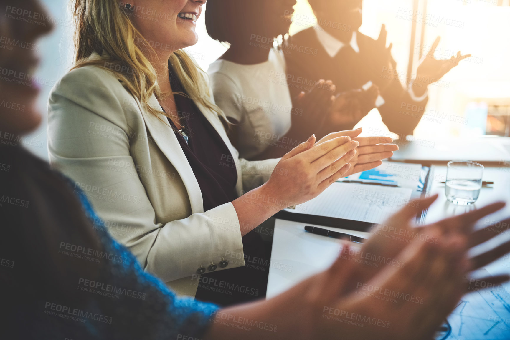 Buy stock photo Cropped shot of a group of businesspeople applauding a business presentation