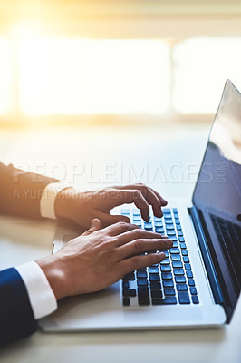 Buy stock photo Closeup shot of an unidentifiable businessman working on a laptop in an office