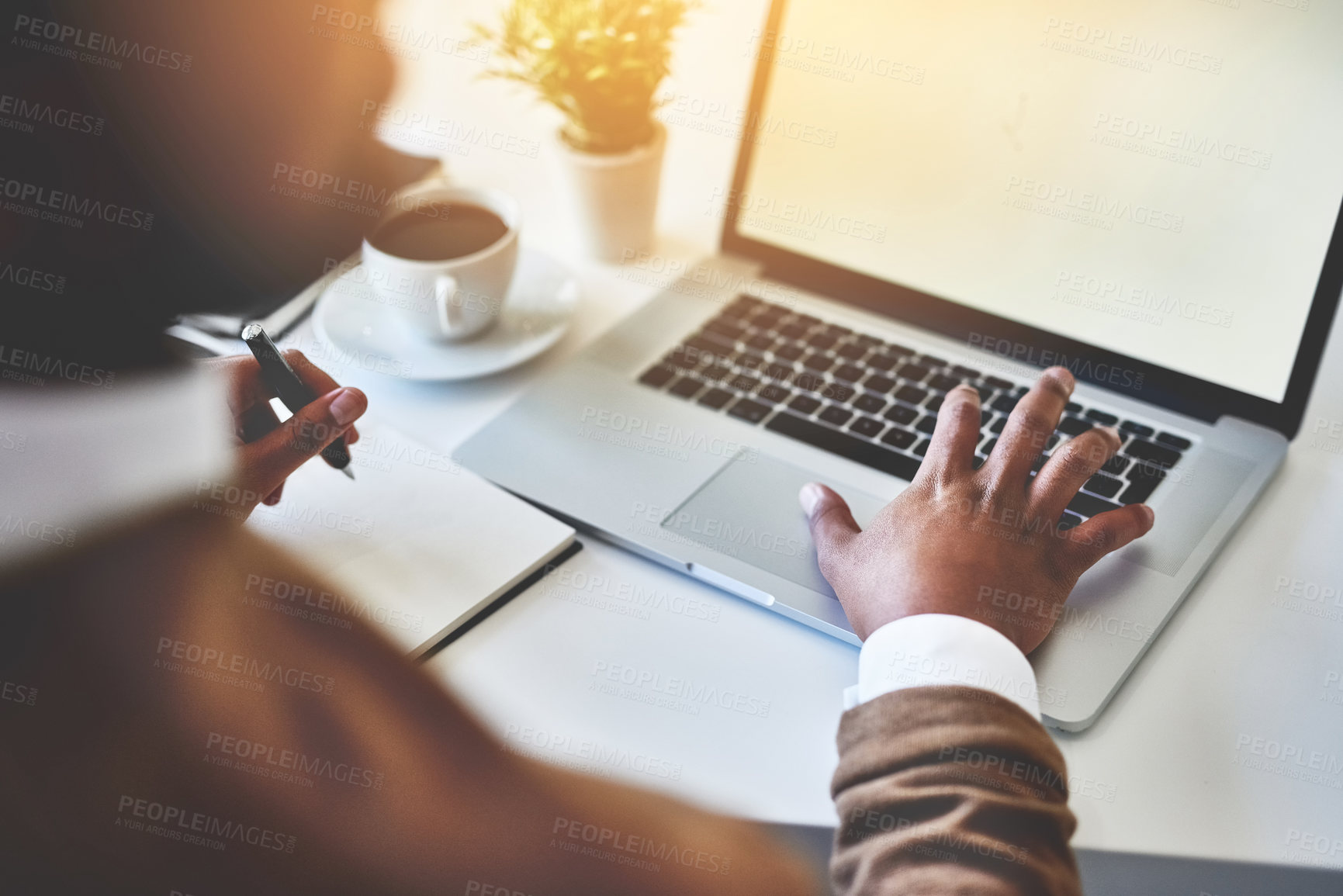 Buy stock photo Closeup shot of an unidentifiable businessman working on a laptop in an office