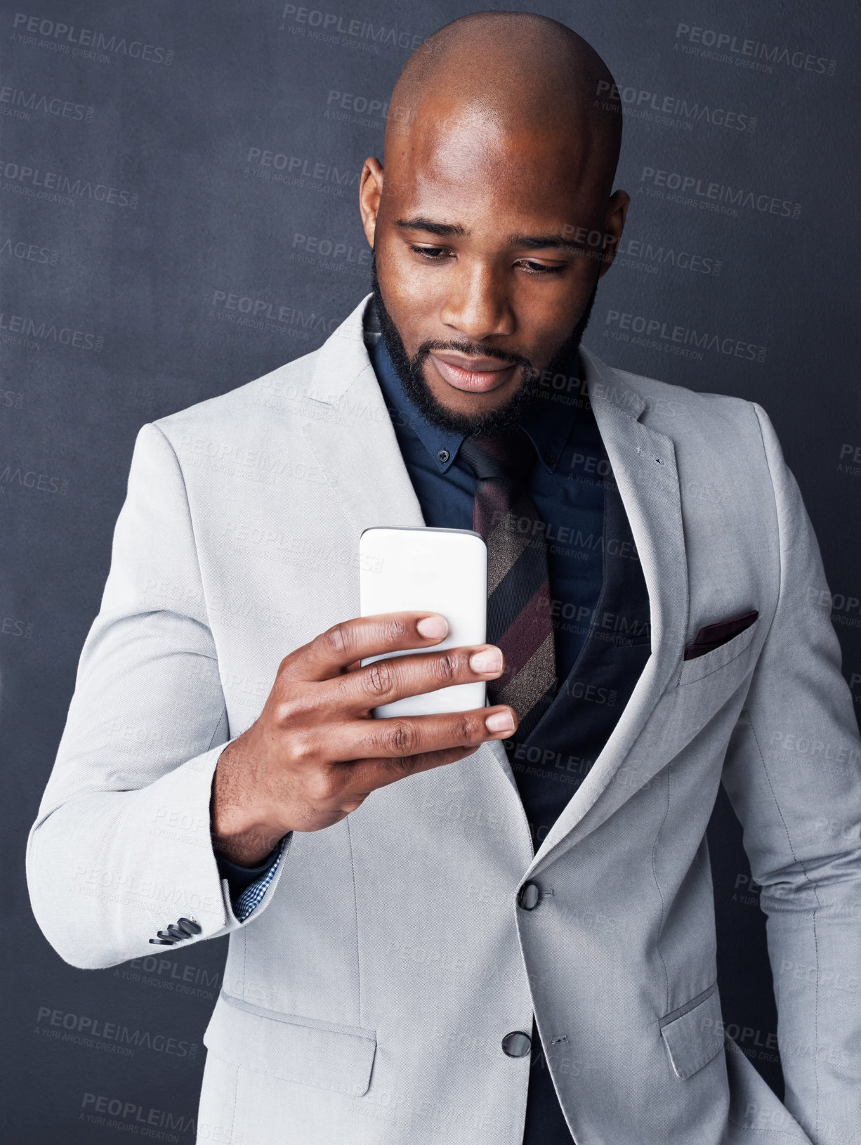 Buy stock photo Professional, phone and business black man in studio for communication, contact and networking. Corporate boss, gray background and isolated person on smartphone for email, social media and website