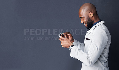 Buy stock photo Tablet, search and business man isolated on a dark background with mockup for news, information or social media. Professional african person typing, reading or scroll on digital tech on a banner wall