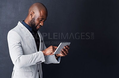 Buy stock photo Tablet, typing and business man isolated on dark background and mockup of stock market or online finance. Accountant or corporate african person trading, scroll and digital technology on banner wall