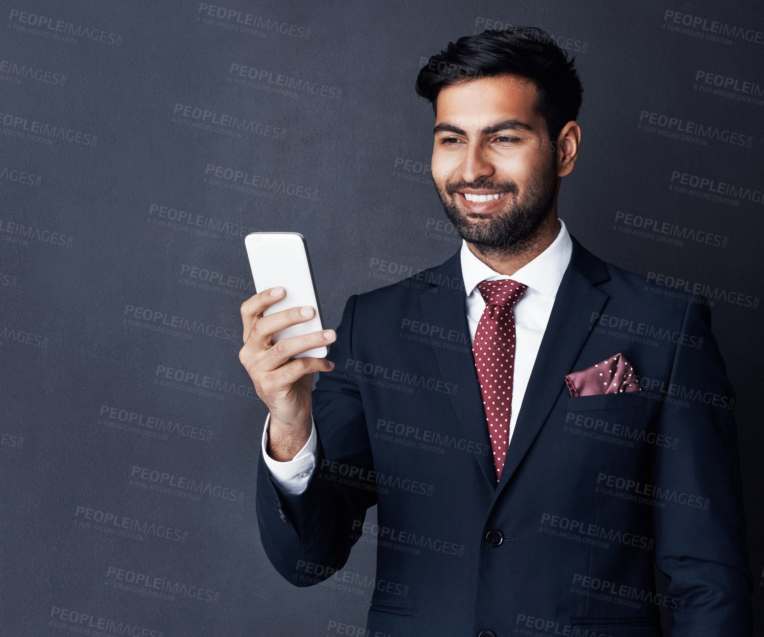 Buy stock photo Happy, phone and business man on dark background for video call, contact and networking. Professional, corporate and entrepreneur on smartphone for communication, social media and website in studio