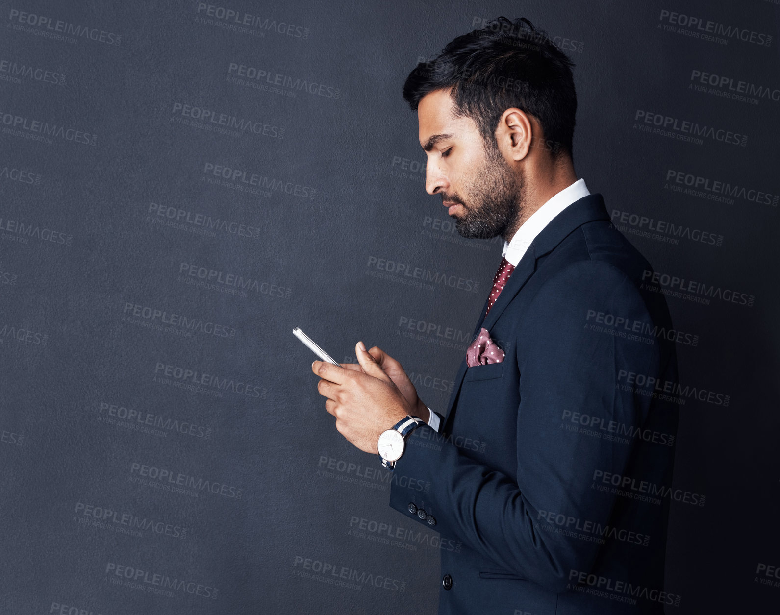 Buy stock photo Phone, typing and business man isolated on a dark gray background for career news, information or social media. Corporate person in suit reading chat on smartphone for networking and job opportunity