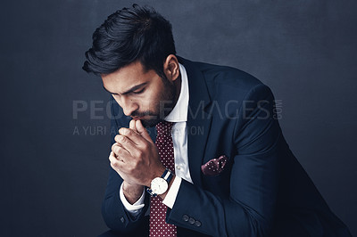 Buy stock photo Business, thinking or Indian man with anxiety, fail or consultant against a dark studio background. Male person, employee or agent with stress, mistake or financial report with depression or confused
