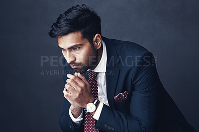 Buy stock photo Business, thinking and Indian man with anxiety, depression and employee on a dark studio background. Male person, ceo or consultant with stress, planning or worry with mental health issue or confused