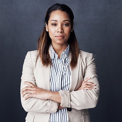 Buy stock photo Studio shot of a young woman posing against a gray background